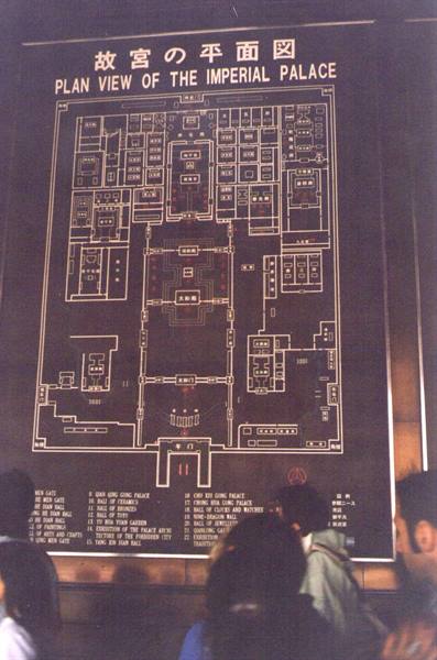 Visitors reading the bronze map plan of the Forbidden City, Beijing