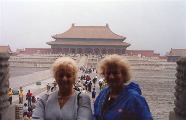 Two tourists in front of the Forbidden City hall, Beijing