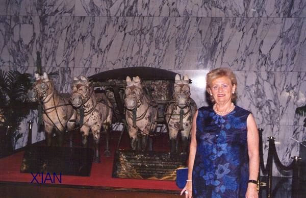 Woman beside the bronze horses of the terracotta army, Xi'an