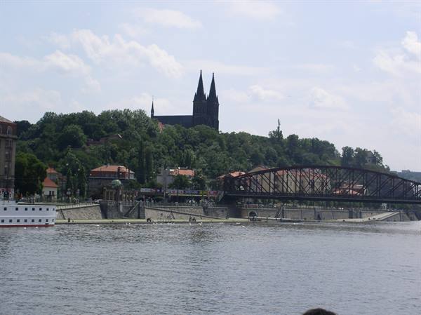 Vyšehrad's Saints Peter and Paul basilica above the Vltava with iron bridge