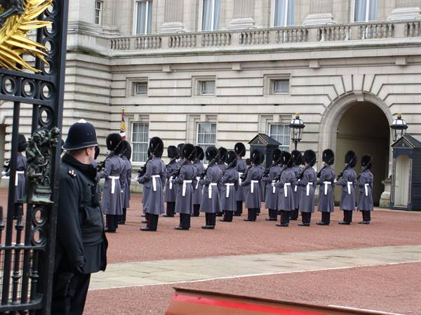 Royal guards in bearskins lined up in Buckingham Palace courtyard, London