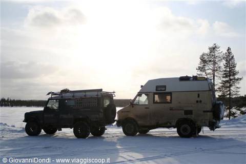 The two vehicles on the shores of a frozen lake