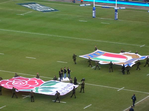 Twickenham: soldiers unfurl England and Italy flags on the pitch