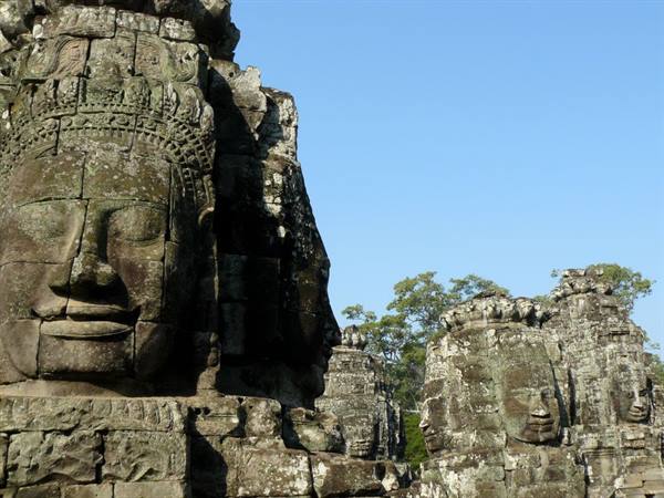 Carved stone faces on the towers of Bayon temple, Angkor Thom