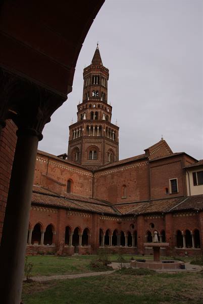 The brick cloister of Chiaravalle Abbey with its Gothic bell tower