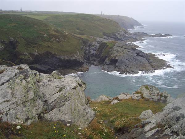 Lizard Point, Cornwall: granite cliffs, grassy headland and waves breaking on rocks