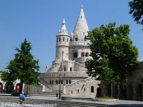 White stone conical tower of Fisherman's Bastion under blue sky