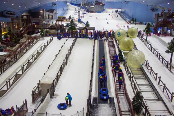 Indoor snow slopes with tubing lanes, giant zorbs and skiers at Ski Dubai