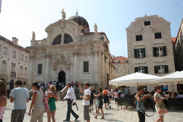 Tourists crowd the square in front of Saint Blaise Baroque church in Dubrovnik