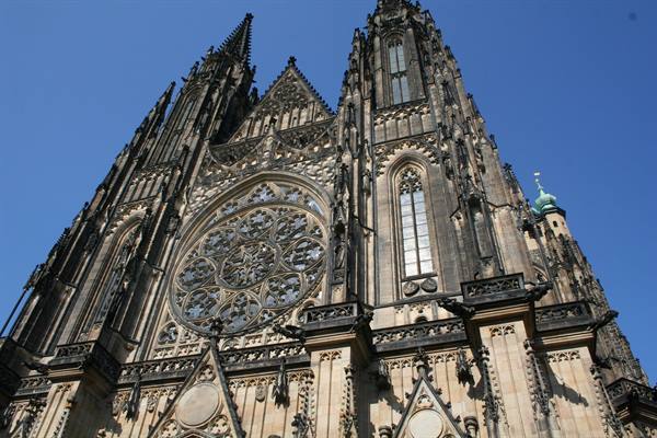 Gothic facade of St. Vitus Cathedral in Prague against blue sky