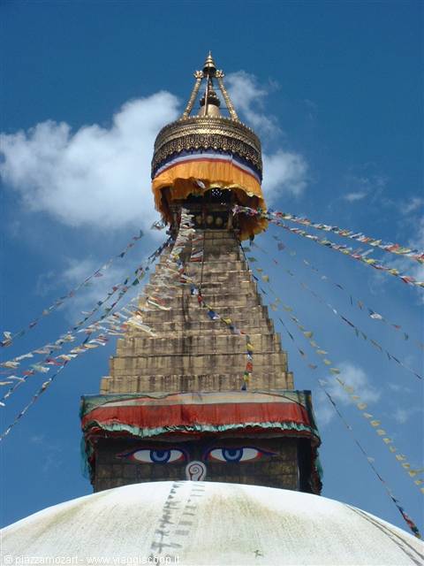 Boudhanath stupa in Kathmandu with Buddha eyes and prayer flags