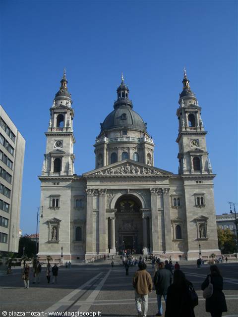 St. Stephen's Basilica in Budapest, facade with dome and twin bell towers, tourists below