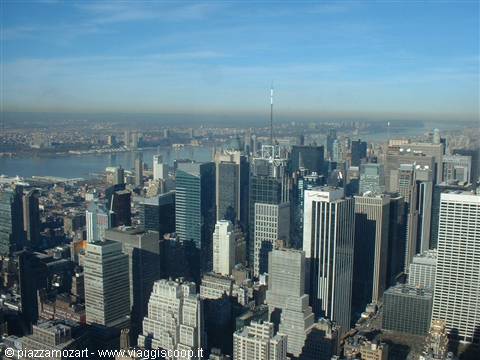 Manhattan skyscrapers with the Empire State Building and river in the background