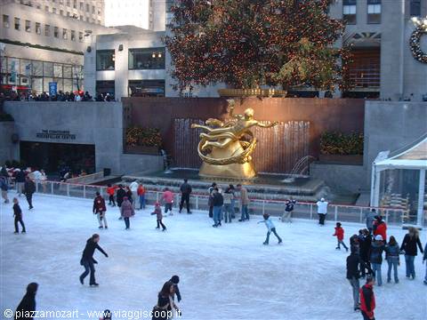 Skaters on the Rockefeller Center ice rink beneath the Christmas tree