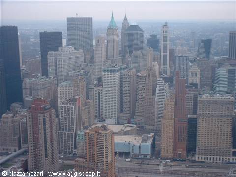 Manhattan skyscrapers under hazy sky, brick and glass towers, diffused light