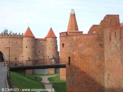 Warsaw Barbican, red brick walls with conical-roofed towers