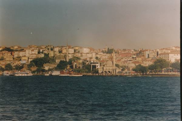 Ferries on the Bosphorus in front of a mosque with minaret in Istanbul