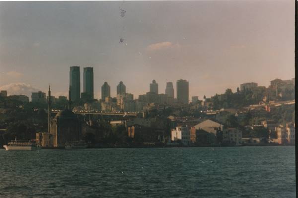 Ortaköy Mosque on the Bosphorus with skyscrapers behind, afternoon light