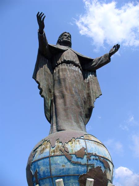 the statue of Cristo Rei overlooking the entrance of the bay of Dili