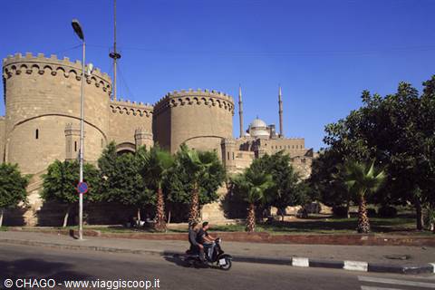 Towers of Saladin Citadel in Cairo, Muhammad Ali Mosque, scooter under palm trees