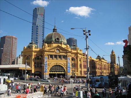 Pedestrians crossing the intersection in front of Flinders Street Station, Melbourne