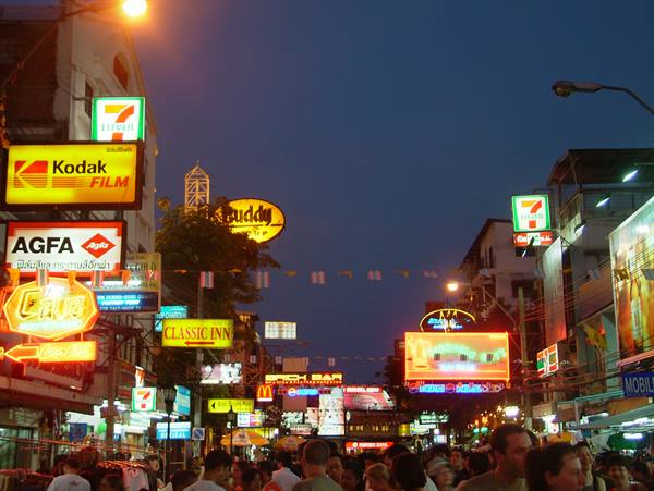 Crowd under neon signs on Khao San Road, Bangkok
