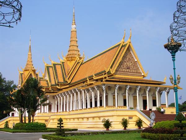 Royal Palace of Phnom Penh, golden roofs and spires under blue sky