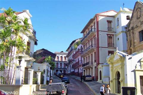 Uphill street among restored colonial buildings and church, Casco Viejo, Panama