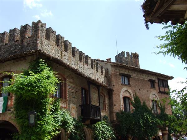 Medieval Village of Turin, brick walls with battlements under sunny sky