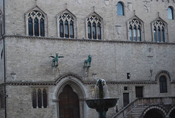 Palazzo dei Priori in Perugia with bronze griffin and lion above the fountain