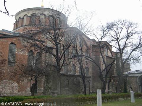Hagia Irene church in Istanbul, brick walls and dome among bare trees
