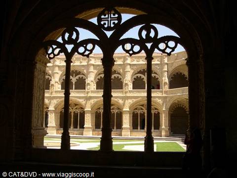 Manueline cloister of the Jerónimos Monastery, stone arches in sunlight
