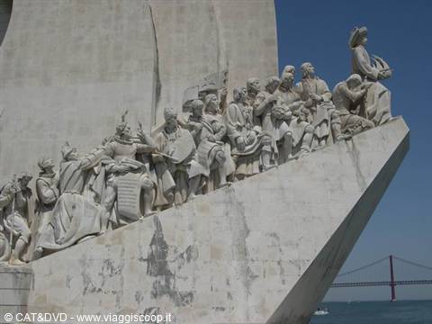 Discoveries Monument in Lisbon, stone statues against blue sky