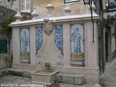 Baroque stone fountain with blue azulejo panels in Sintra