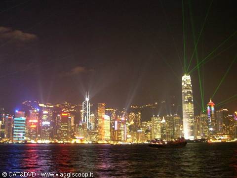 Hong Kong skyscrapers lit up with green laser show over the harbour