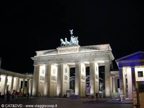 Brandenburg Gate illuminated at night in Berlin, quadriga on top