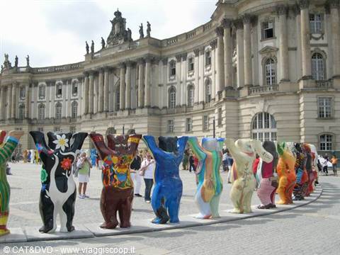 Colorful painted bears lined up in front of Berlin's baroque palace