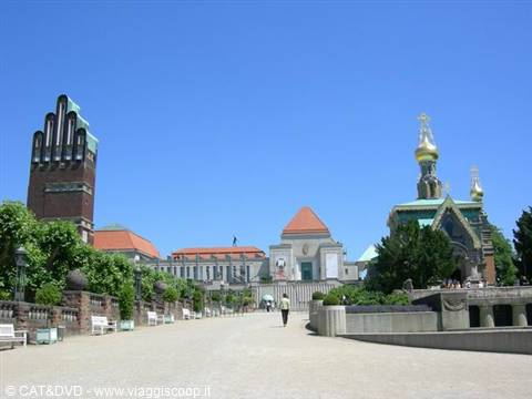 Mathildenhöhe in Darmstadt: brick tower and golden Russian chapel under blue sky