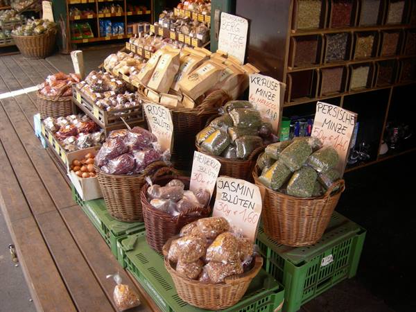 Wicker baskets with tea and spices at an outdoor market stall