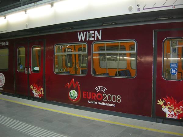 Red Vienna metro train with UEFA Euro 2008 advertisement