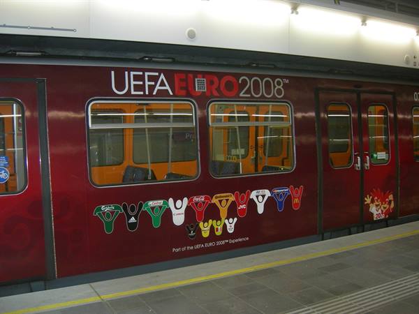 Red metro carriage with UEFA Euro 2008 advertising, at the station
