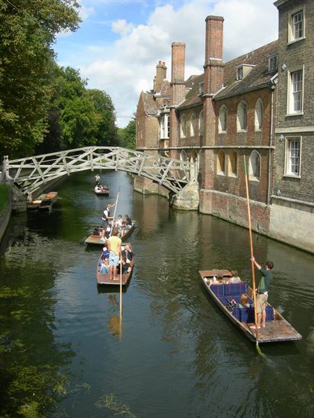 Punters on wooden boats beneath the Mathematical Bridge, Queens' College, Cambridge