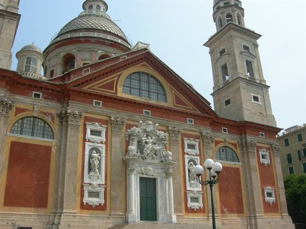 Baroque facade of Santa Maria Assunta basilica in Genoa, dome and bell tower