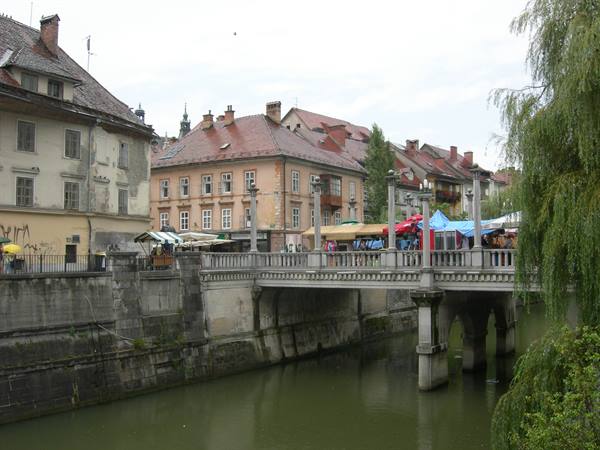 Stone bridge with market stalls over the Ljubljanica river, Ljubljana