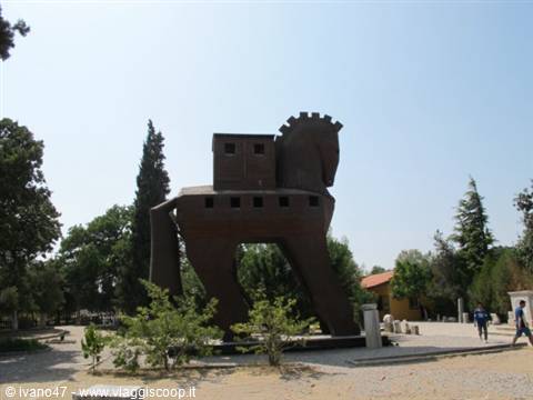 Wooden Trojan Horse, tourists walk through the sunny archaeological site
