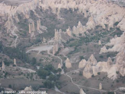 Cappadocia: fairy chimneys carved in volcanic rock among paths and greenery