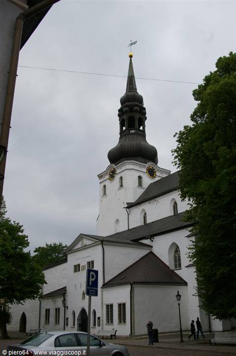 St. Mary's Cathedral in Tallinn, white facade with baroque spire under grey sky