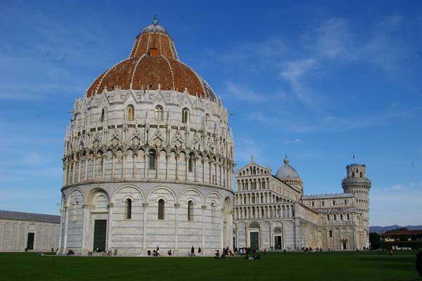 Baptistery and Cathedral at Piazza dei Miracoli with the Leaning Tower on the lawn