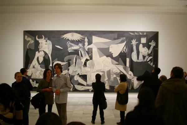 Visitors admire Picasso's Guernica at the Reina Sofía Museum in Madrid