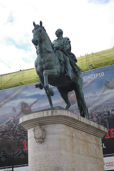 Bronze equestrian statue of Carlos III on stone pedestal in Madrid
